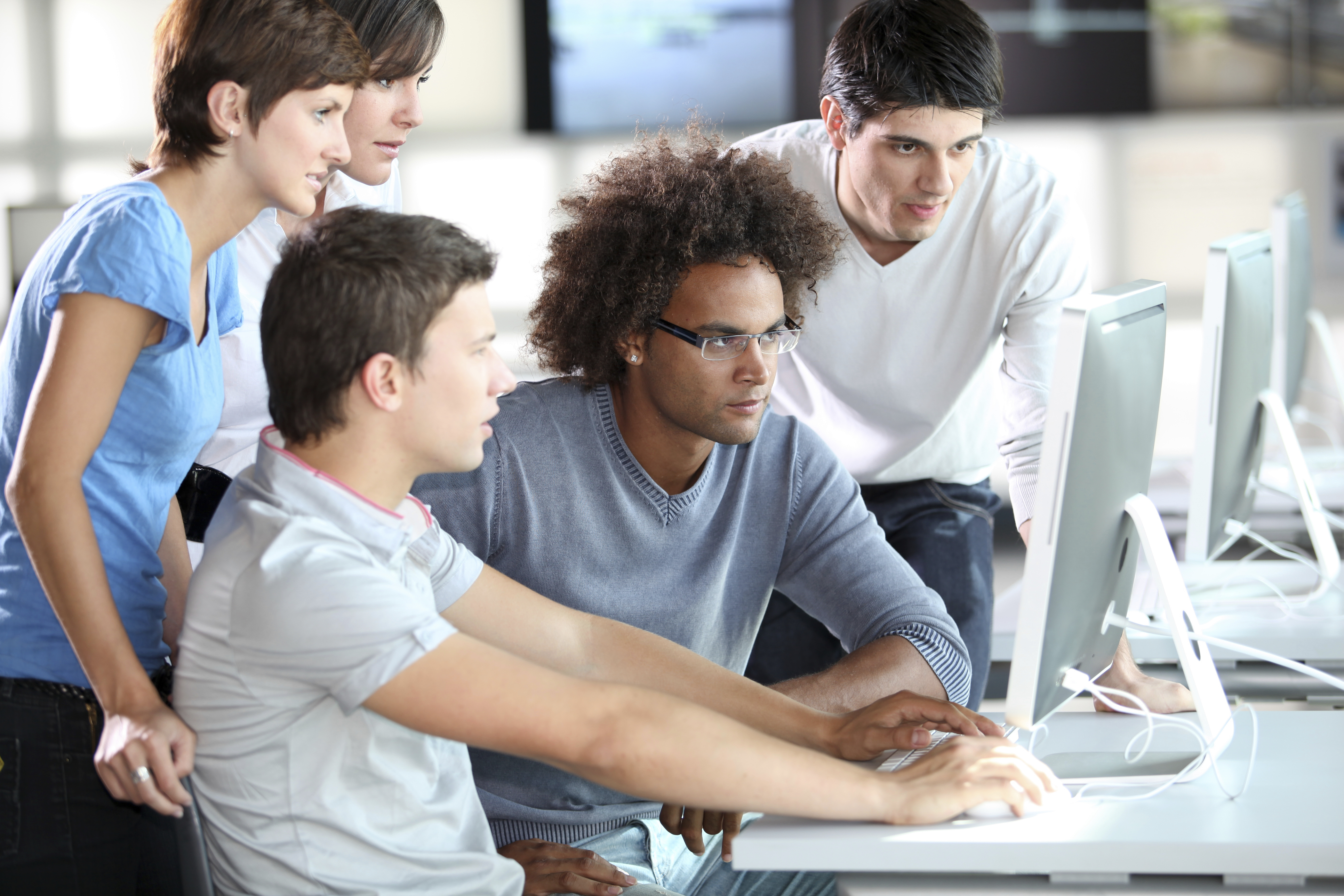 Youths In Education Working At Computers